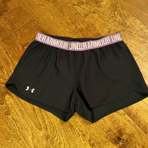 Small black under armor shorts with a purple waist band
